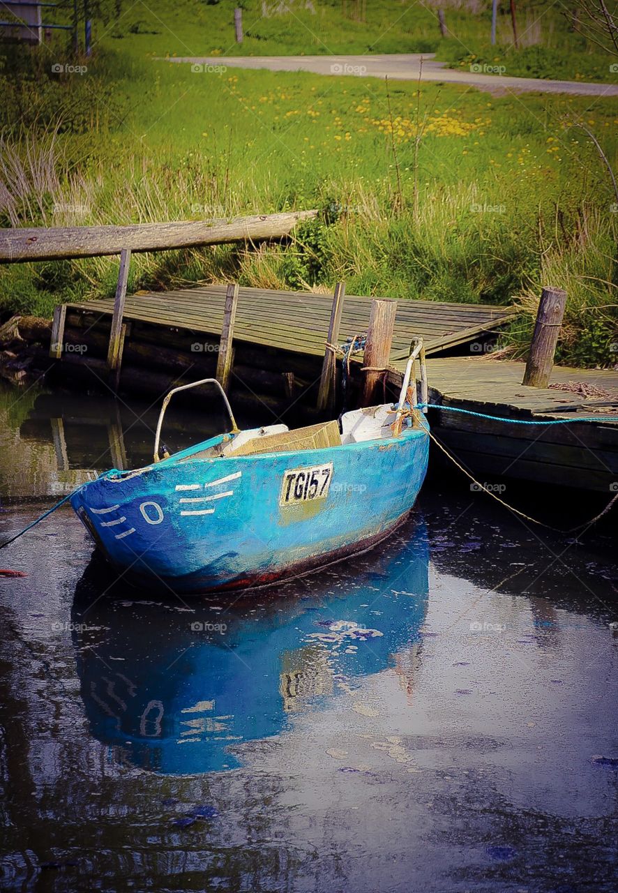 Abandoned blue boat. Abandoned blue boat
