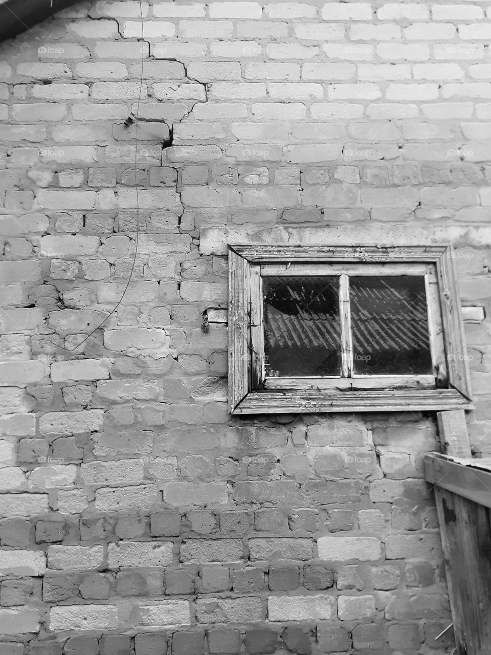 Black and white photo of a brick house