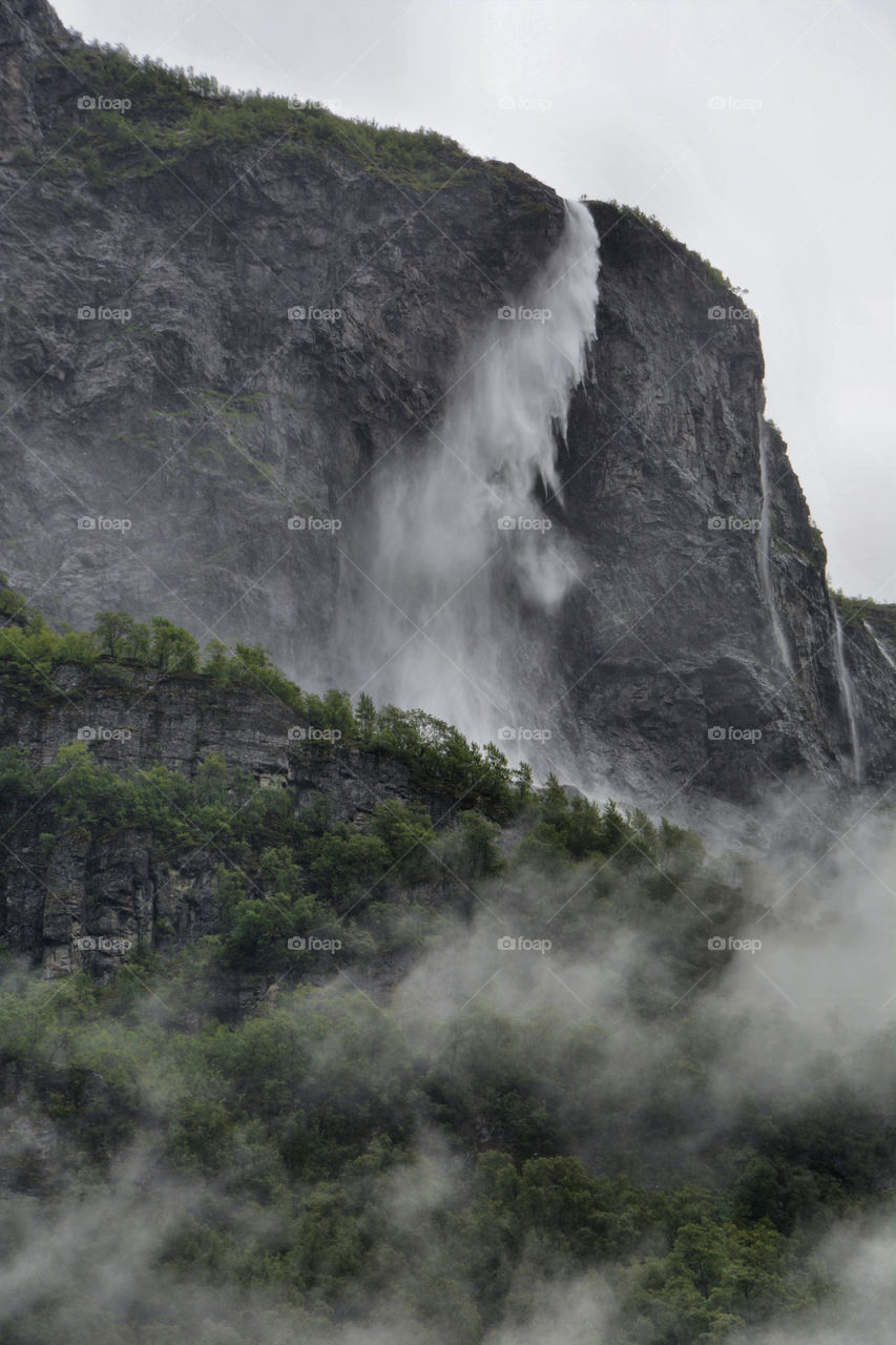 Kjelfossen, Gudvangen, Norway. This spectacular 2500ft (600m) waterfall tumbles over the mountain edge with the water blown in the wind.