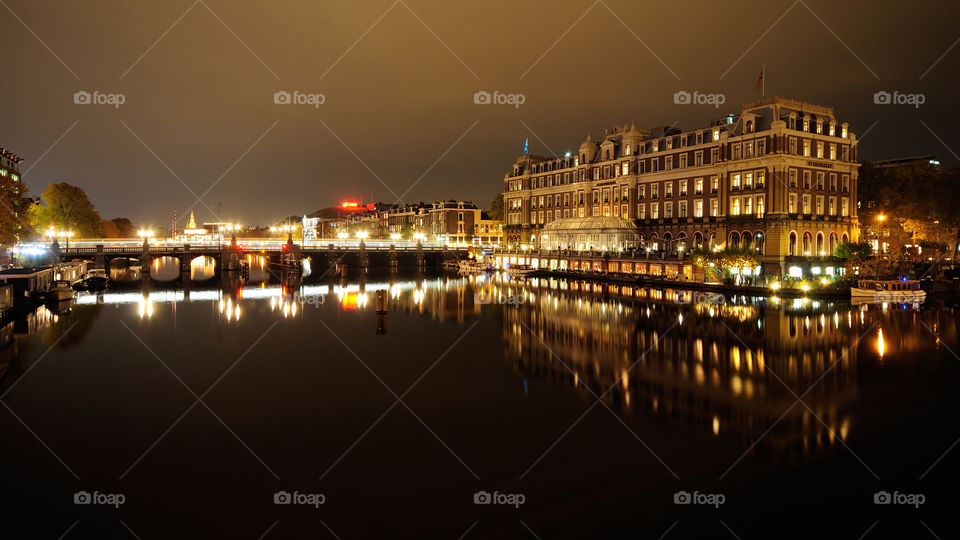 Amsterdam hotel by night. One of the most famous and expensive luxury hotels in Amsterdam. Shot at night by the water