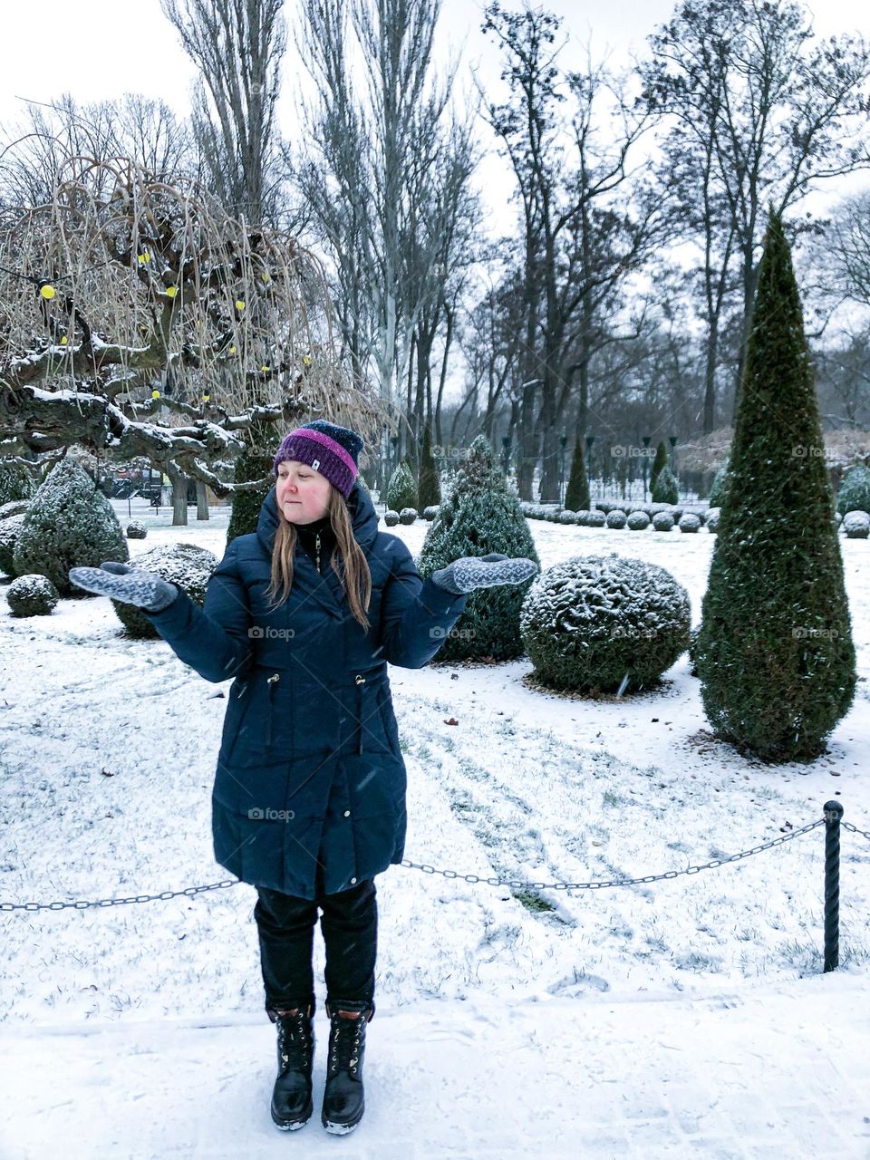 winter woman park let it snow white green trees bushes plants 