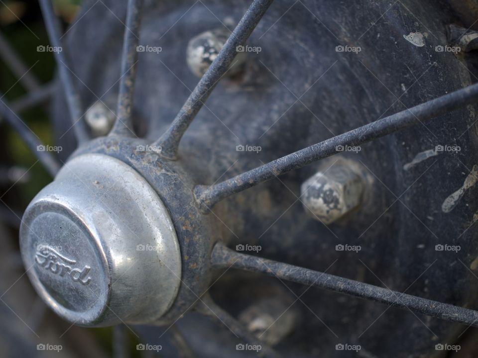 The hubcap on an old Ford Pickup truck 