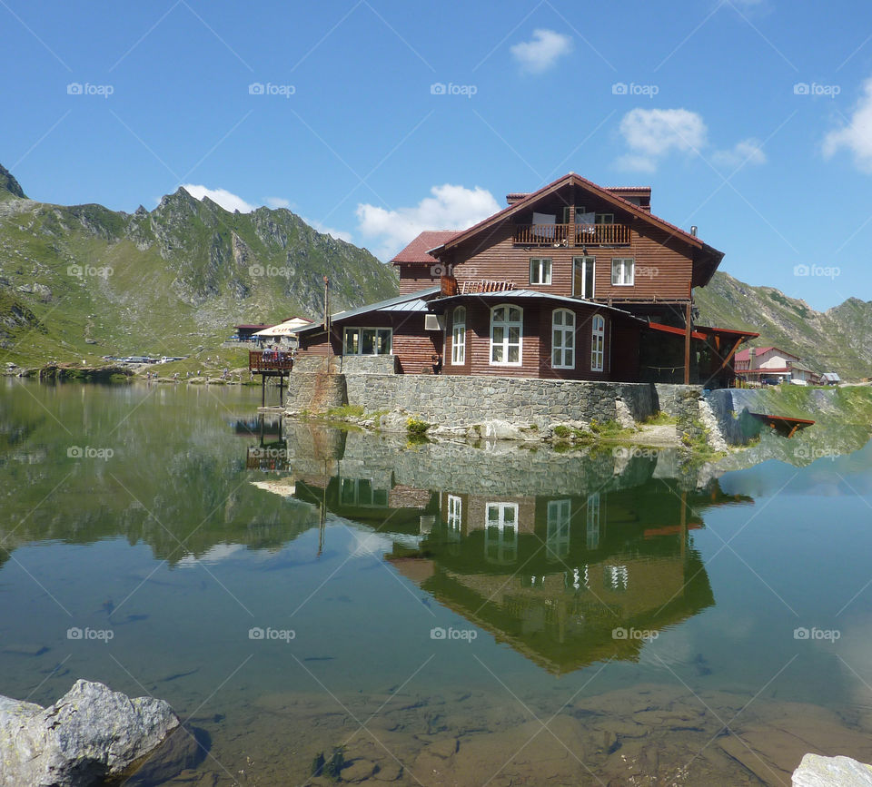 wonderful house mirroring in the water