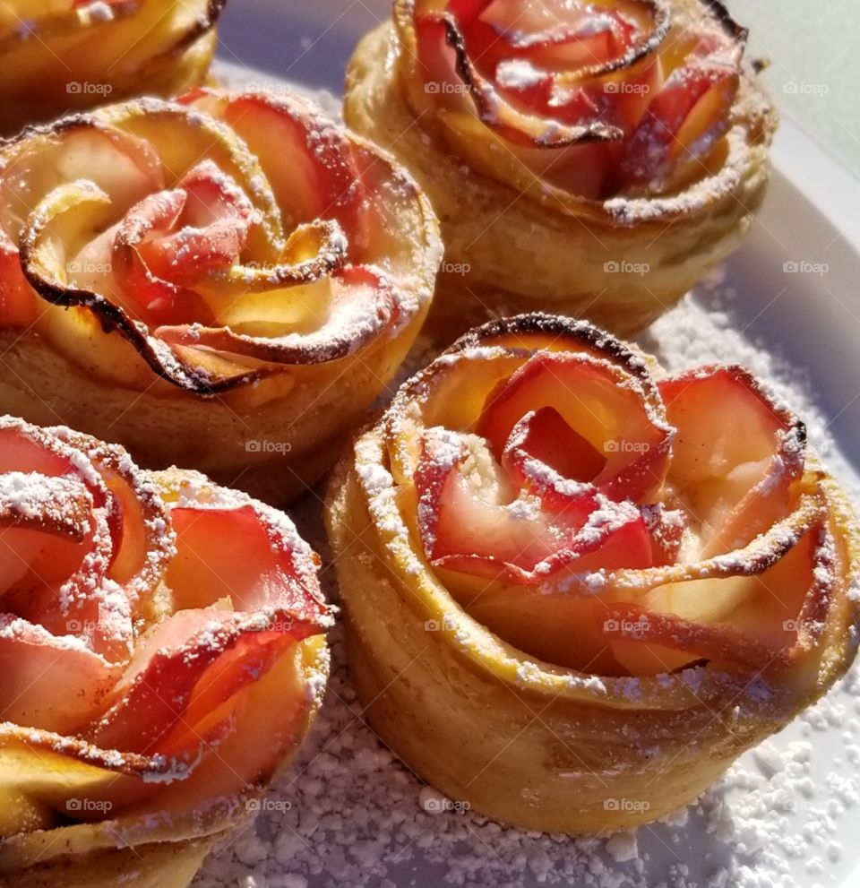 The Last Rose of Summer. Puff pastry, with MacIntosh and Honeycrisp apple slices, rolled up with strawberry jam and cream cheese. Finished with a dusting of confectioner's sugar like the first frost of early autumn.