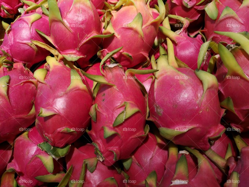 Close-up of many dragon fruits.