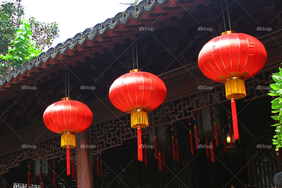 red lampion in yuyuan garden. red lampions hanging from a roof in yuyuan garden, shanghai, china