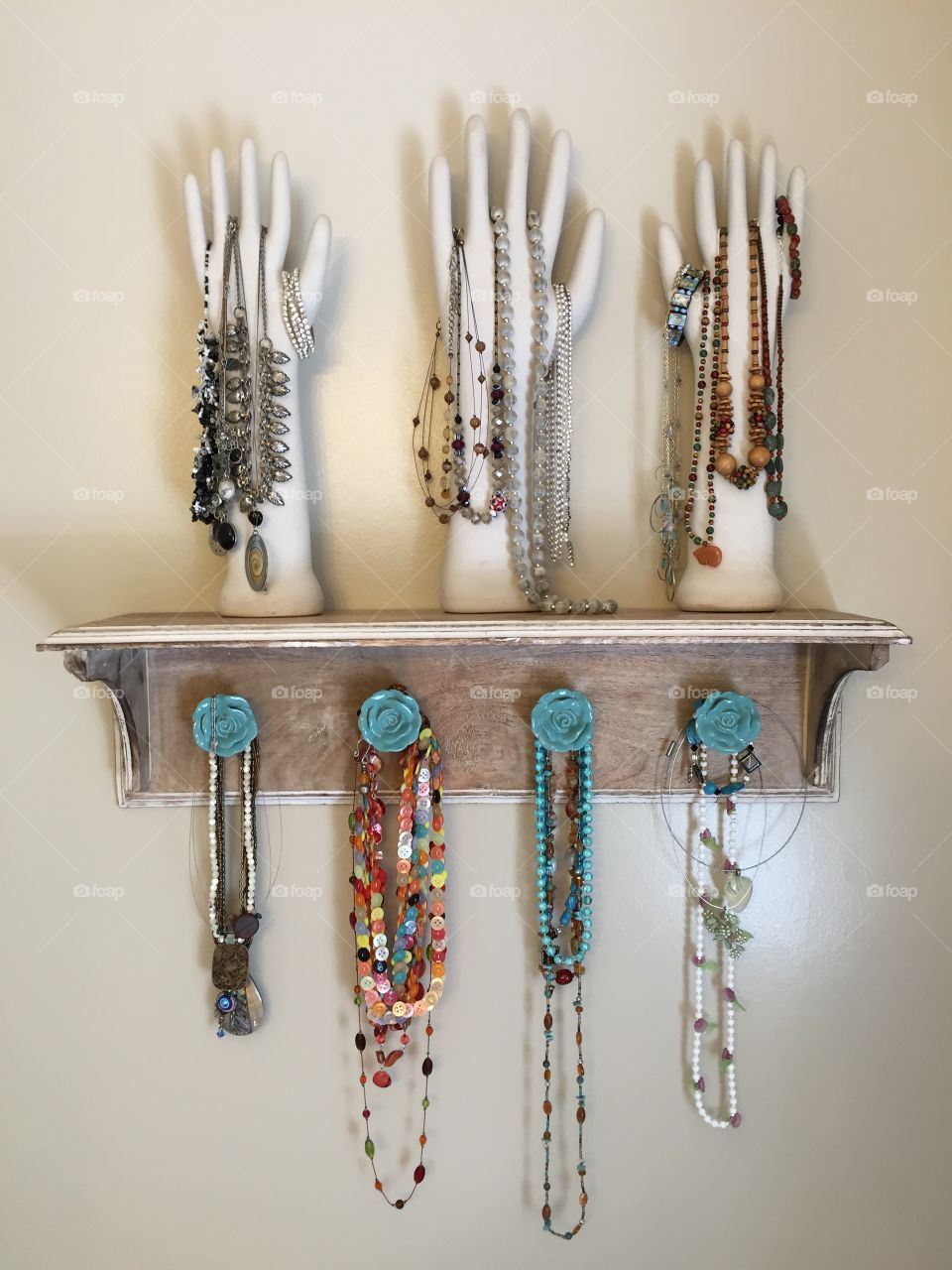 Women's jewelry. Women's jewelry hanging on a shelf and ceramic hands from the balsams grand resort hotel
