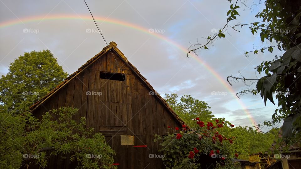 Rainbow over old barn