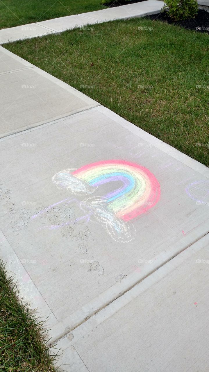 sidewalk chalk rainbow child's drawing on sidewalk in Dublin Ohio