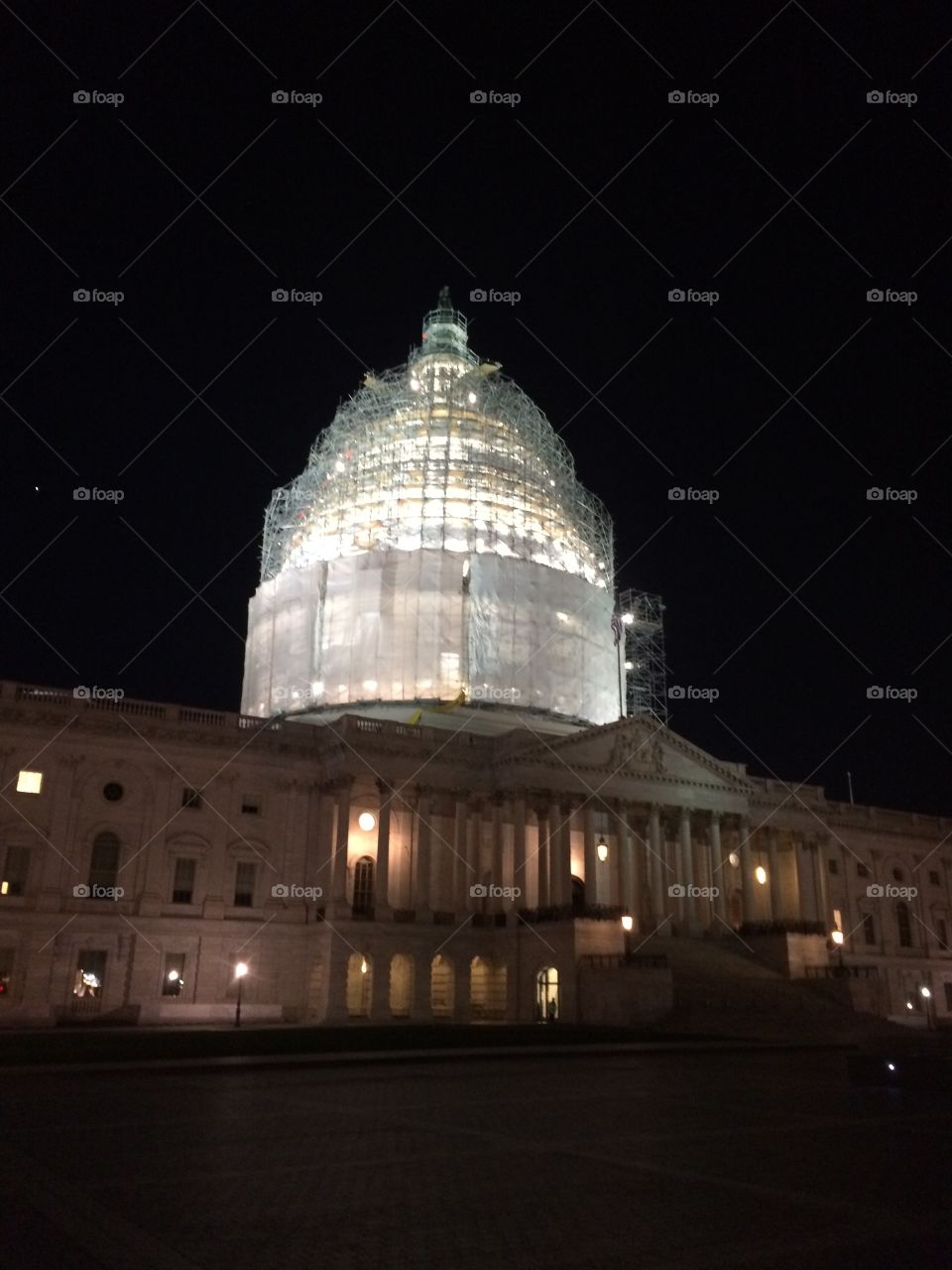 U.S. Capitol.. U.S. Capitol building at night under scaffolding.