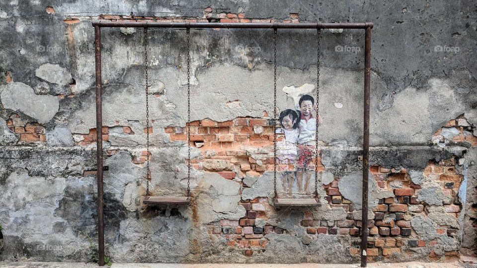 Children on a Swing in Penang, Malaysia