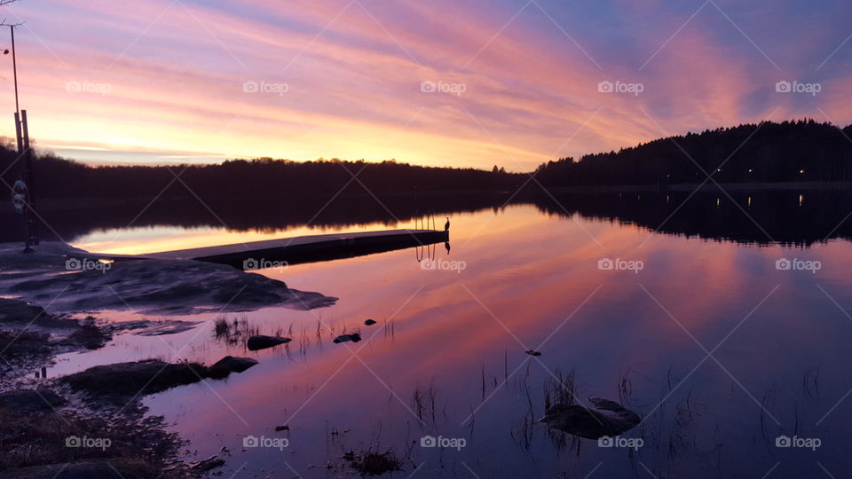 Colorful sunset by the lake - reflections  - solnedgång sjö brygga fågel 