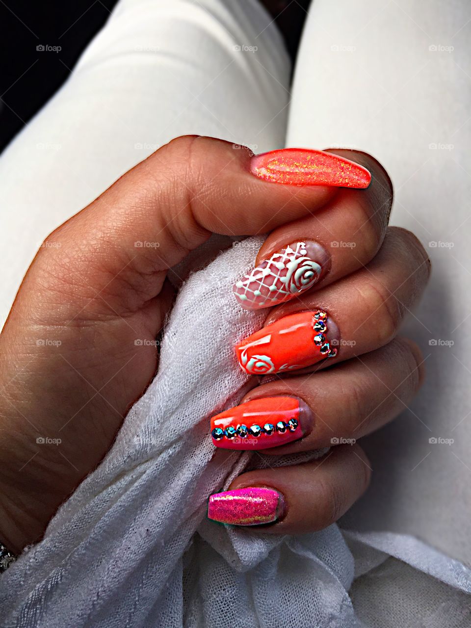 Orange nail polish with jewels and painted flower! 