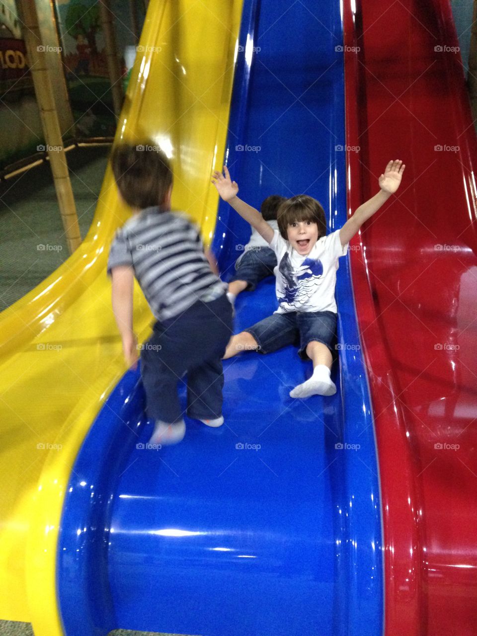 Kids having fun on a triple slide!
