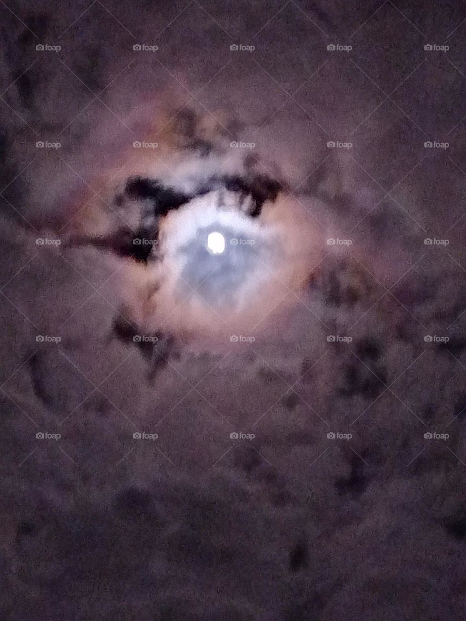 the moon in the clouds