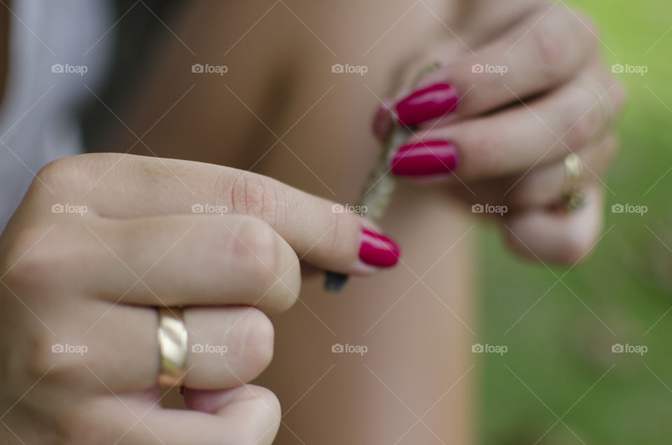 Woman holding a joint