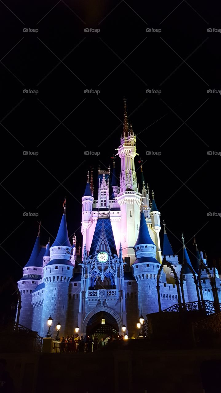 The sun may have set, but Cinderella Castle shines bright at Walt Disney World in Orlando, Florida.