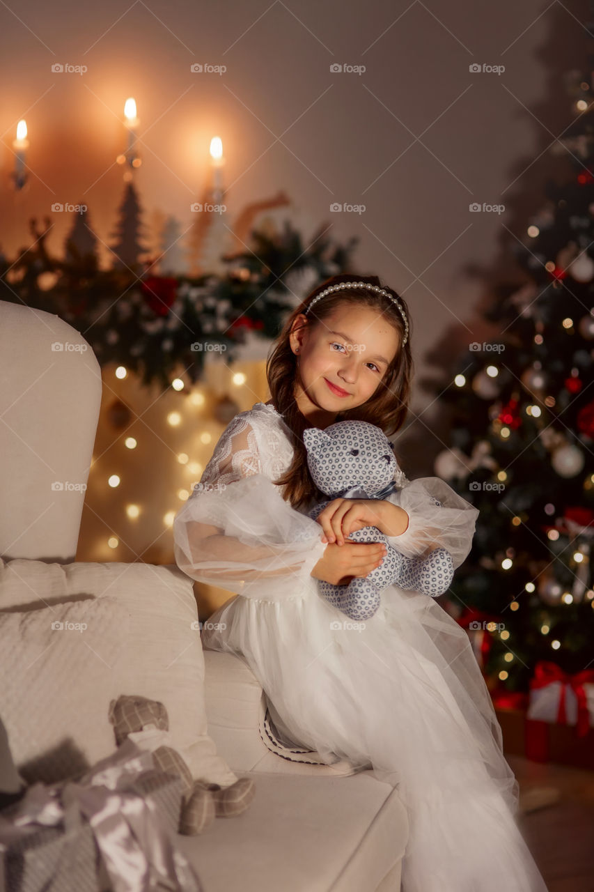 Girl in white dress at Christmas Eve 