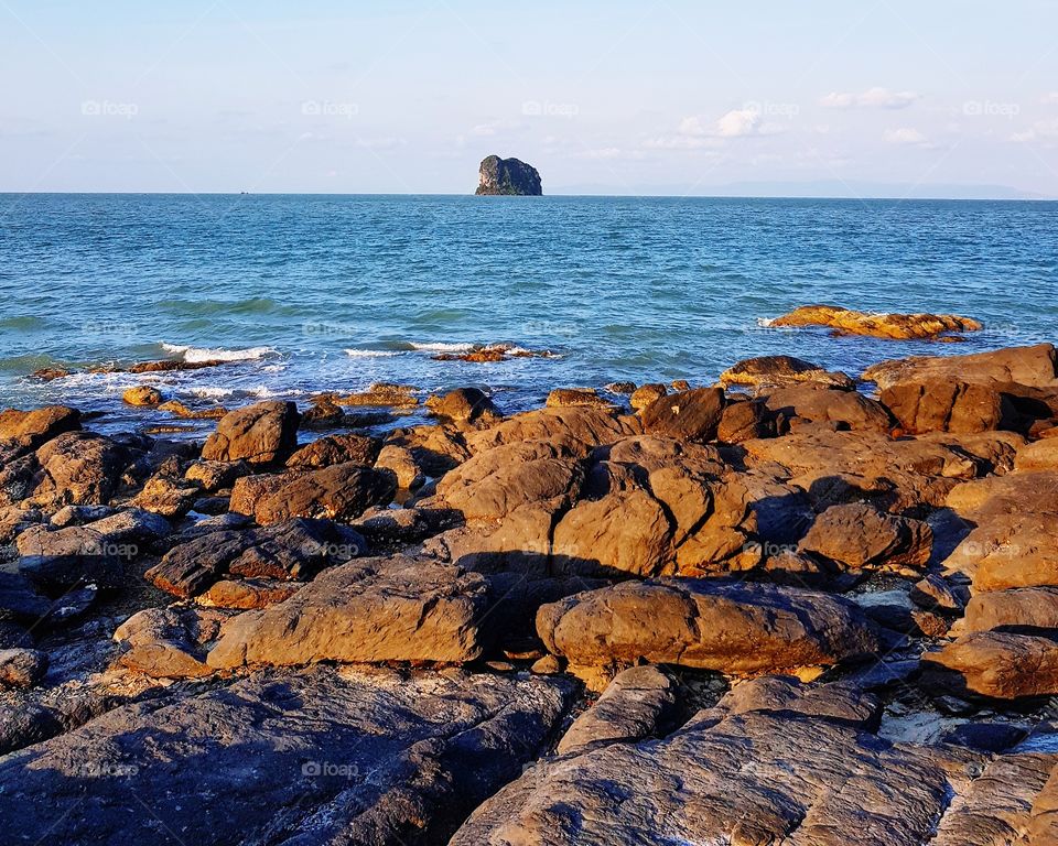 Scenic view of coastline against sky