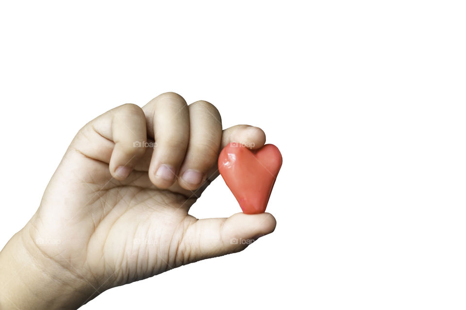 Isolated Hand holding a red candy shape heart on a white background with clipping path.