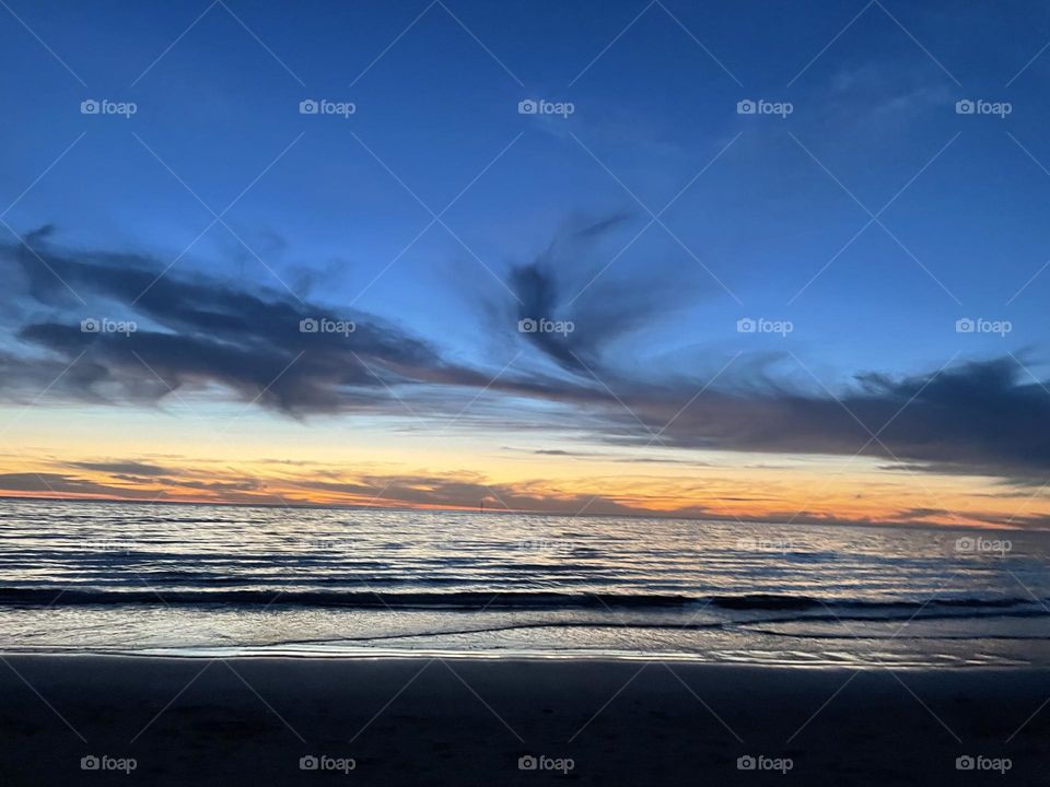 A beach during a sunset 