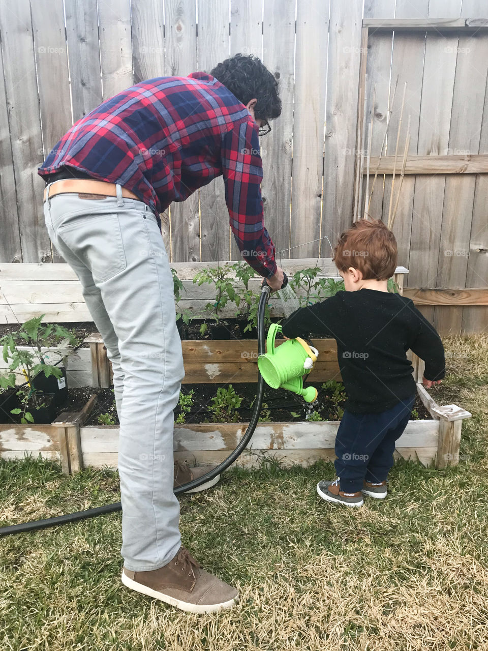 Dad and son gardening 