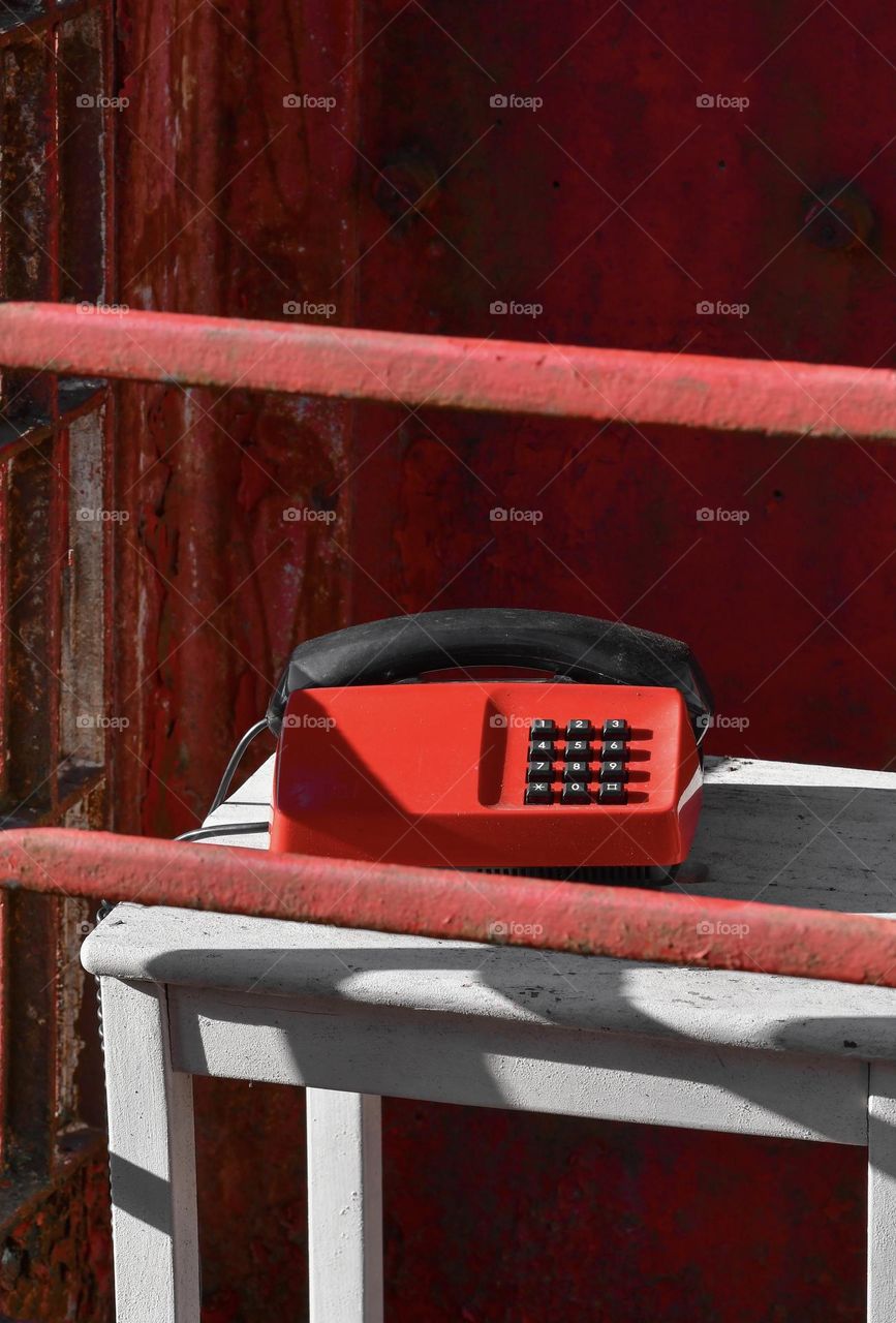 Red ohone in phonebooth