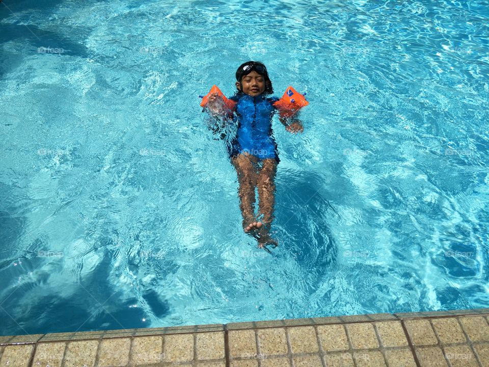 have fun child with swimming pool