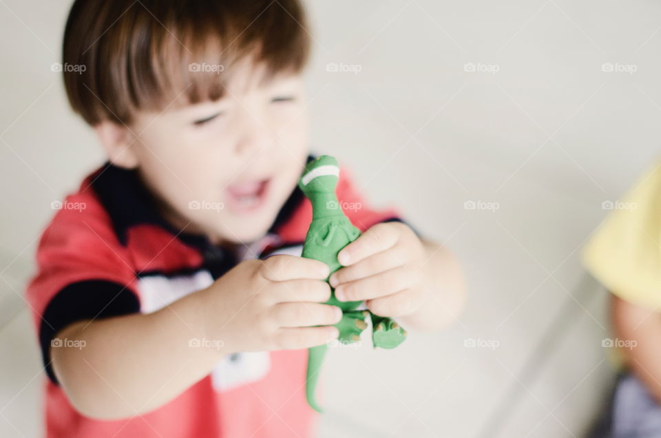Child holding a toy