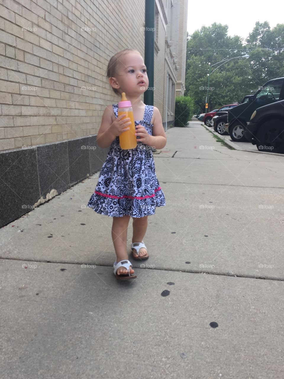 Toddler drinking juice