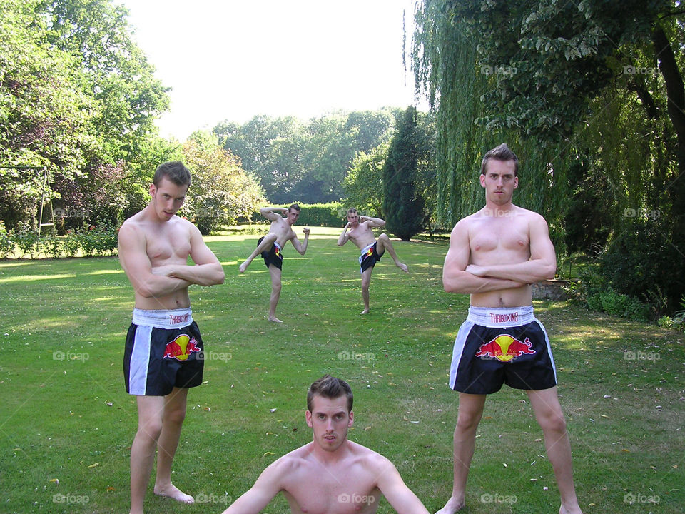 Fighters. multiple model wearing Thai boxing short outdoor