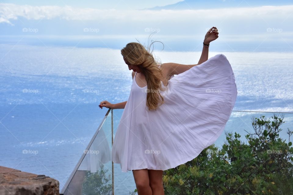 woman in white summer dress on la gomera canary island in Spain