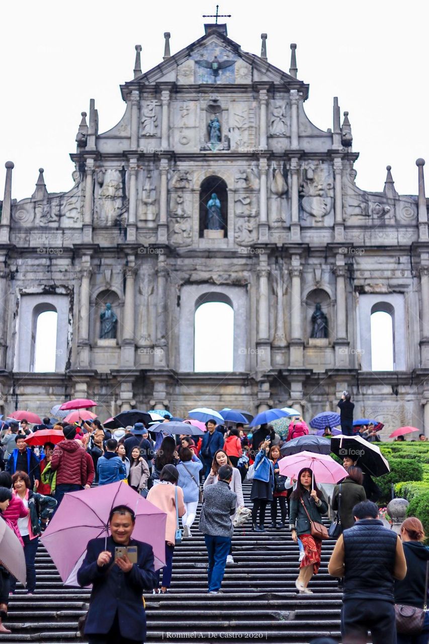 Tourist crowd in a rainy weather.