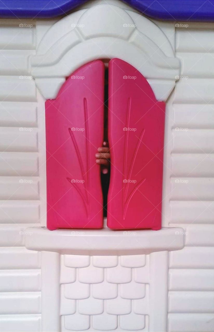 Kid playing in the house toy...