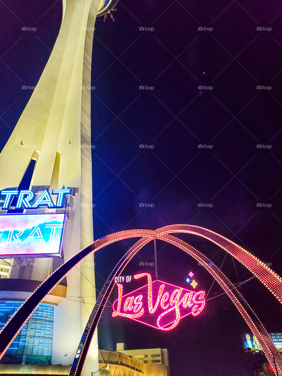 The Stratosphere tower and neon Las Vegas sign light up the north end of the famous Las Vegas strip
