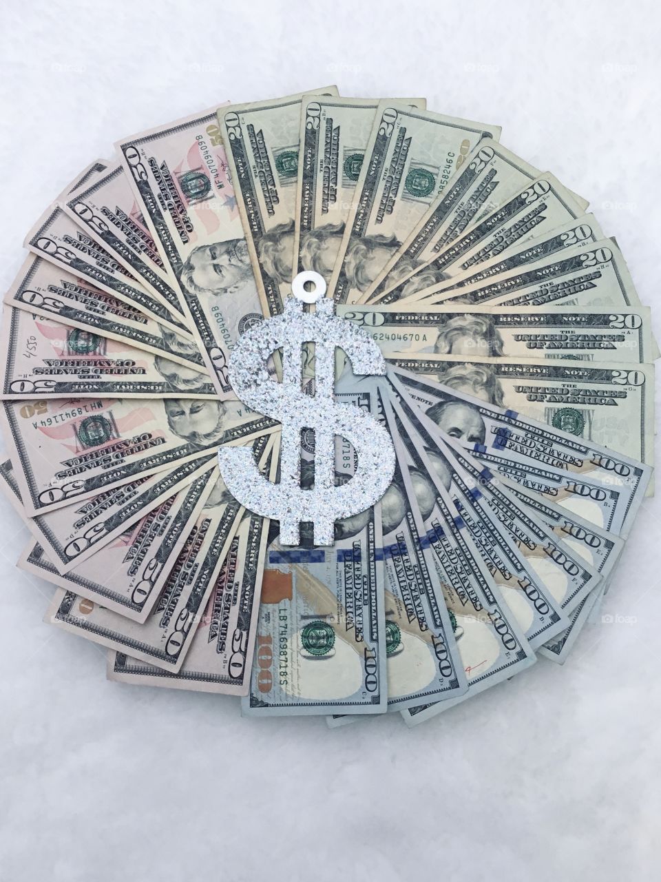 Paper money in different angles - Money is any item or verifiable record that is generally accepted as payment for goods and services and repayment of debts, such as taxes, in a particular country or socio-economic context