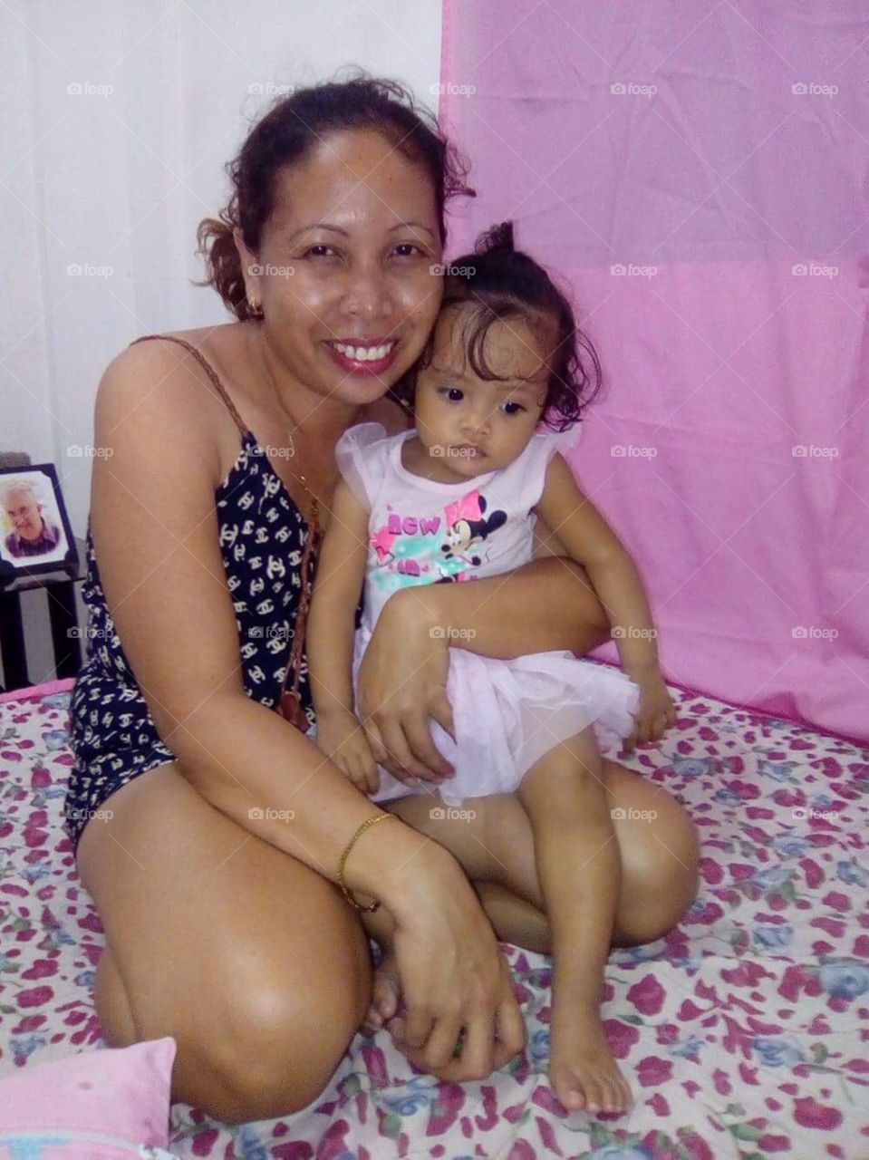 My partner with our youngest, l am sharing because they are so happy and our little Mary looks so cute.