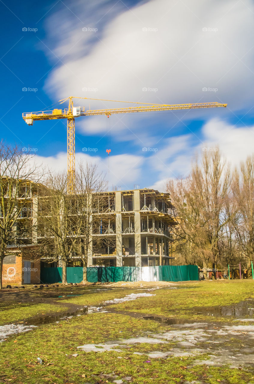 building process with crane on long exposure