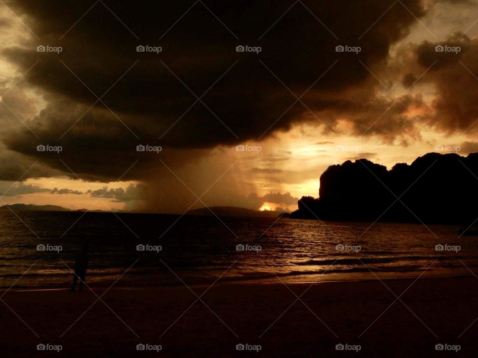 Sunset deluge on a beach in Thailand 