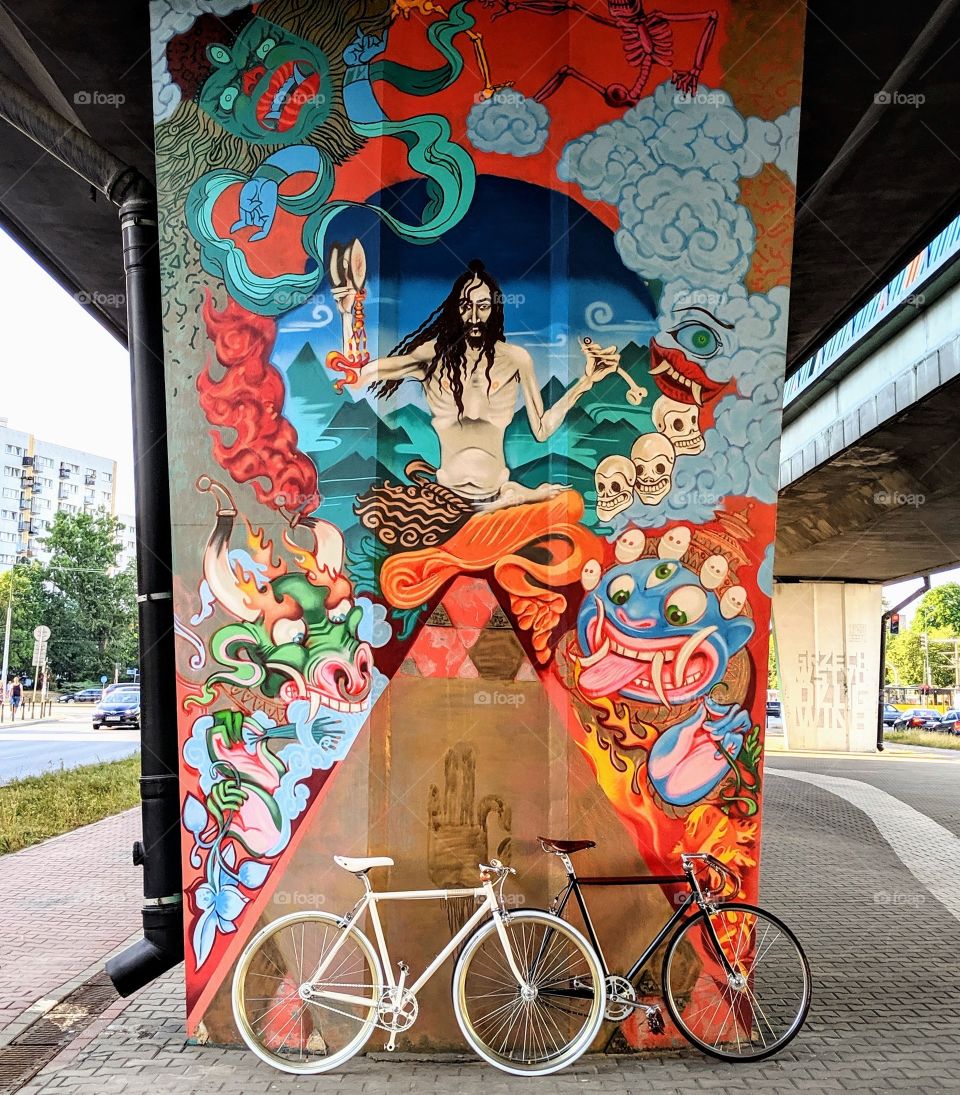 Fixed gear minimalistic bicycles with psychodelic street art