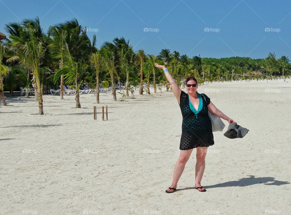 Beach In Cancún . American Tourist On The Beach In Cancún Mexico
