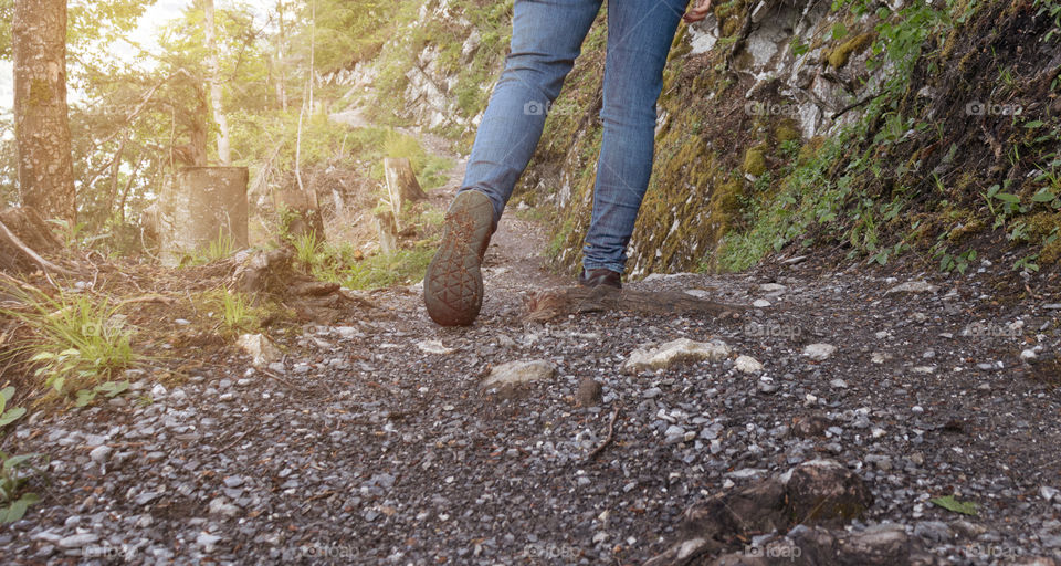 Walking or hiking on small gravel footpath.