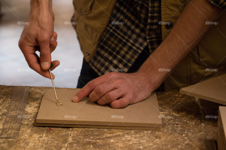 Close-up of a man working with frames
