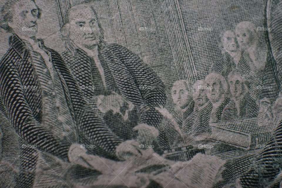 Closeup of the signing of the Declaration of Independence.
