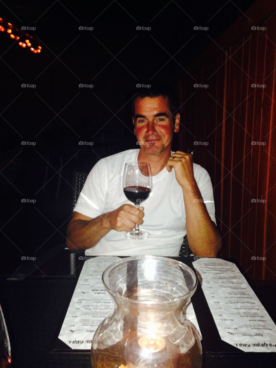 Man enjoying a glass of wine 