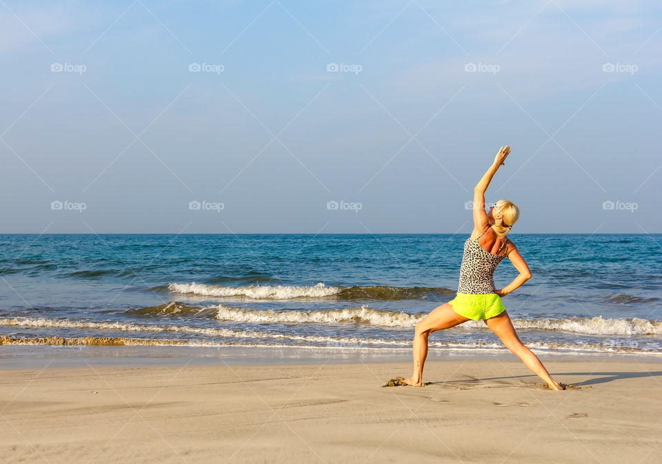 Woman exercising at beach