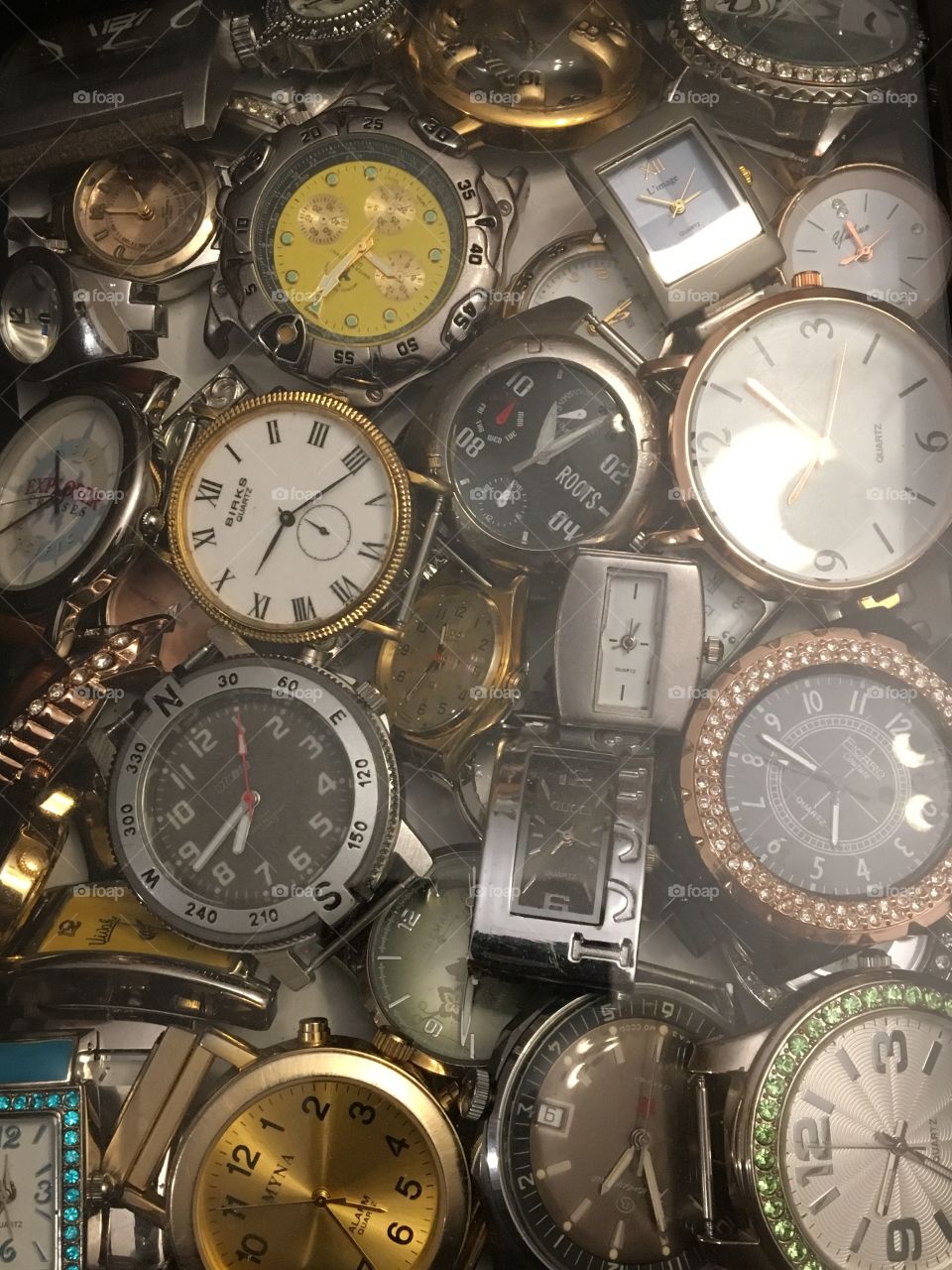 Shadow box filled with watch faces