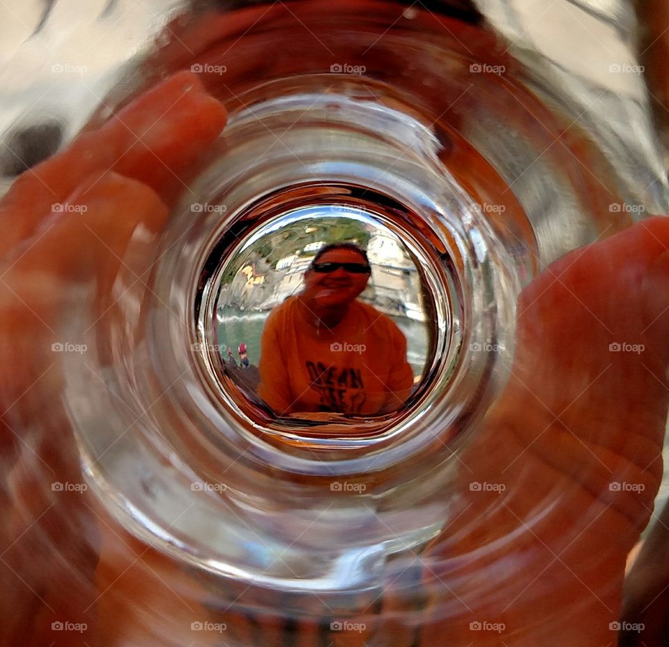 Reflection of woman in glass