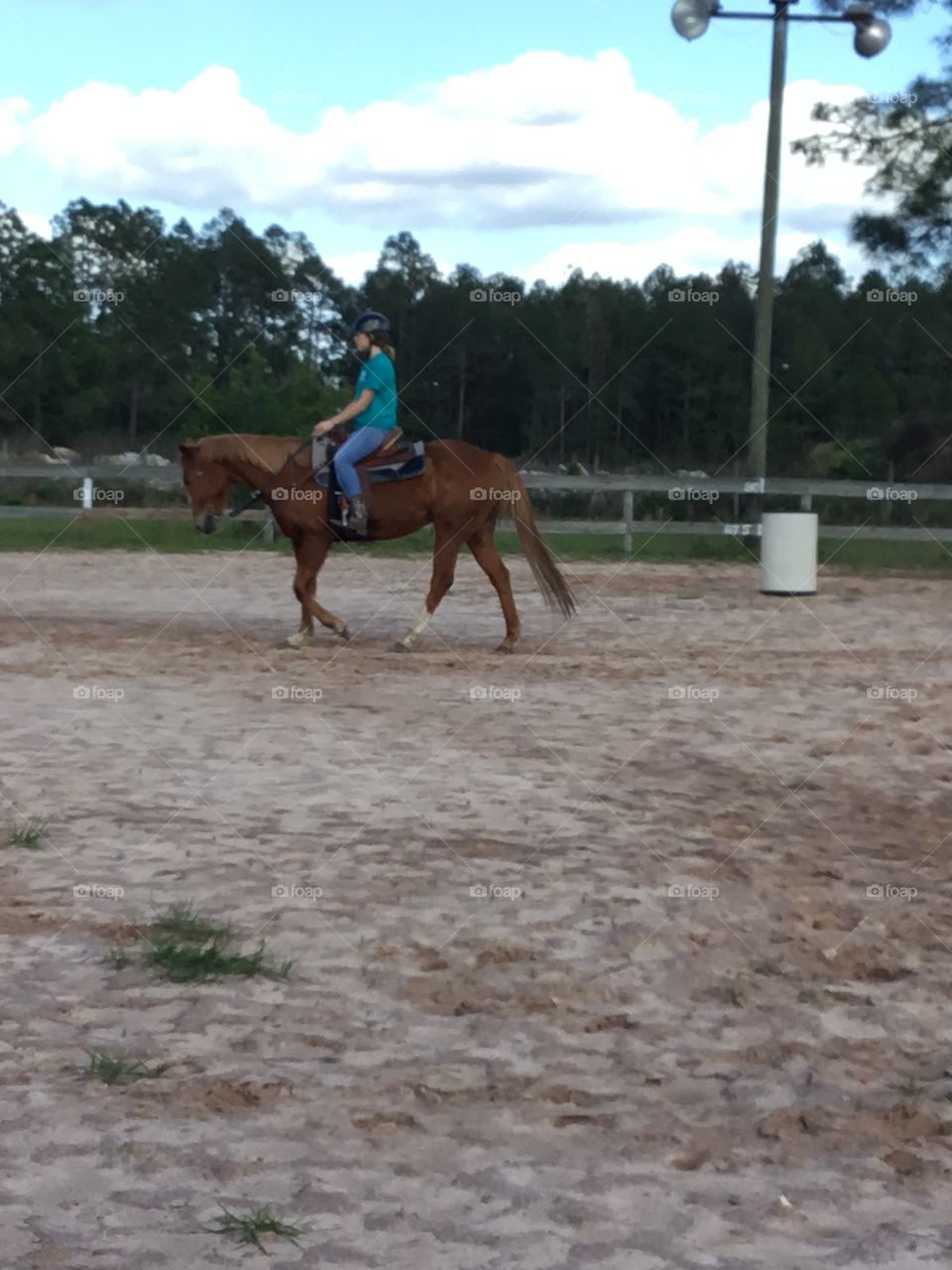 Levi and his rider practicing barrel racing at the saddle club. 