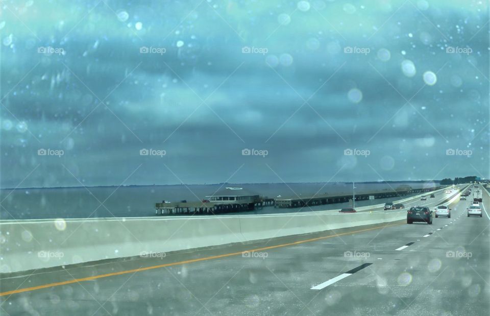 Crossing the Skyway Bridge on a dark rainy day.